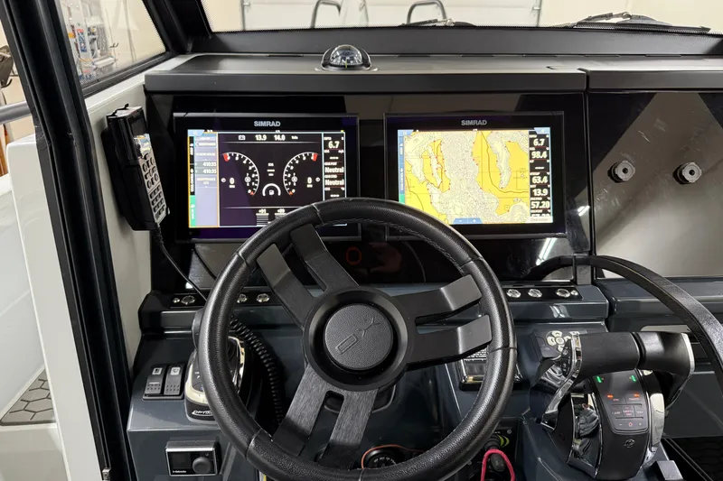 Dfndr1 Yacht Photos Pics Cockpit of 2021 XO Boats DFNDR 9 with dual Simrad displays and steering wheel.