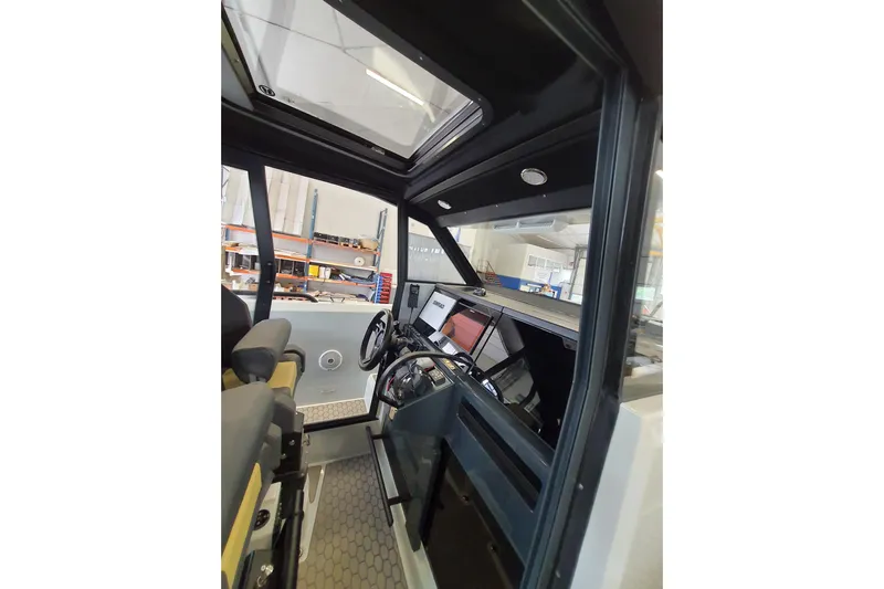 Dfndr1 Yacht Photos Pics 2021 XO Boats DFNDR9 cockpit interior with modern controls and steering wheel.