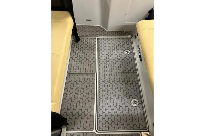 Dfndr1 Yacht Photos Pics 2021 XO Boats DFNDR9 interior flooring with hexagonal pattern and beige seating.