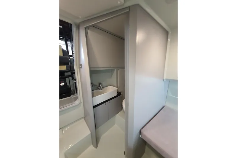 Dfndr1 Yacht Photos Pics 2021 XO Boats DFNDR9 interior bathroom with sink and storage cabinet.