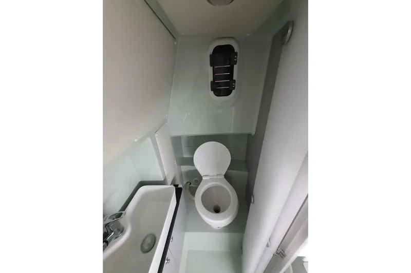 Dfndr1 Yacht Photos Pics 2021 XO Boats DFNDR9 interior bathroom with toilet and sink.