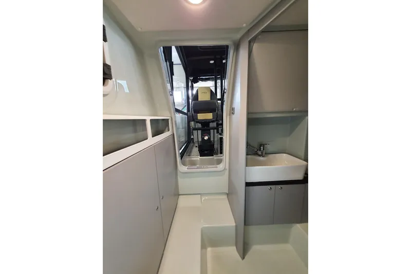 Dfndr1 Yacht Photos Pics Interior of 2021 XO Boats DFNDR9, featuring compact sink and storage cabinets.