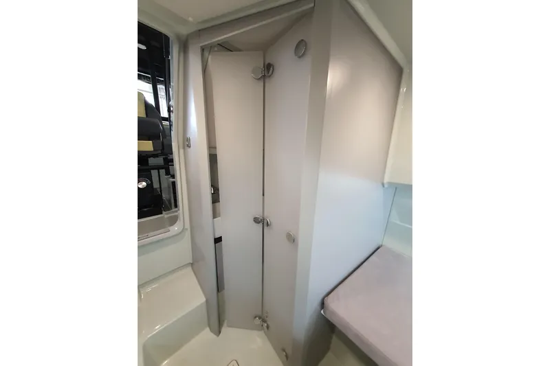 Dfndr1 Yacht Photos Pics 2021 XO Boats DFNDR9 interior cabin with compact bathroom and modern design.