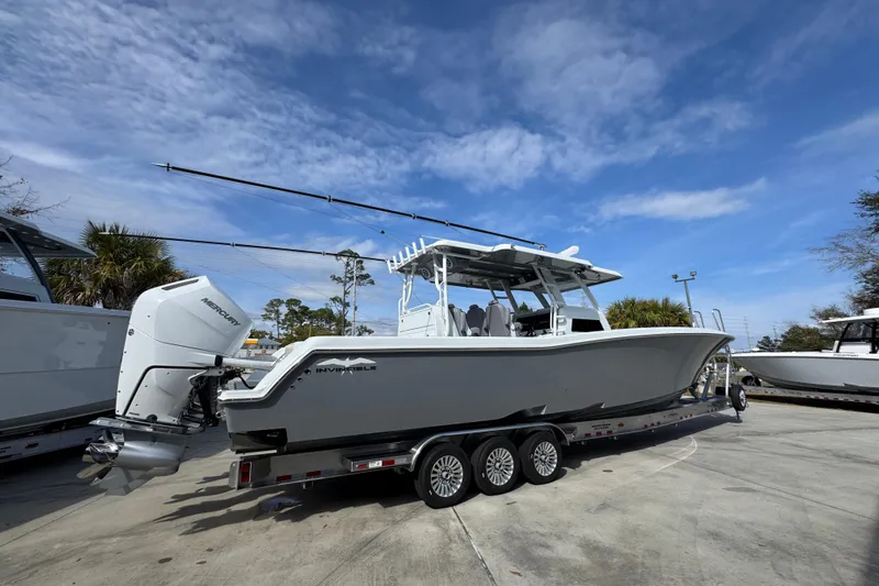  Yacht Photos Pics 2026 Invincible 43 Open Fisherman boat on trailer under blue sky.
