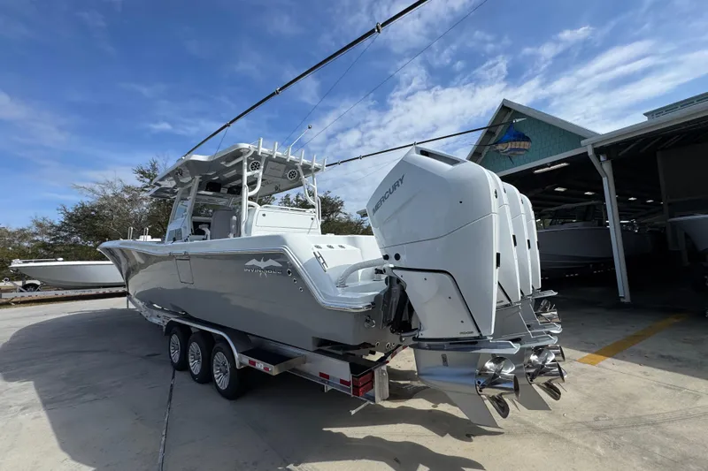  Yacht Photos Pics 2026 Invincible 43 Open Fisherman boat with triple Mercury engines on trailer.