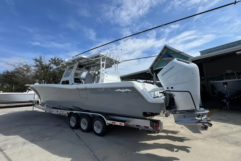  Yacht Photos Pics 2026 Invincible 43 Open Fisherman boat with Mercury engines on a trailer.