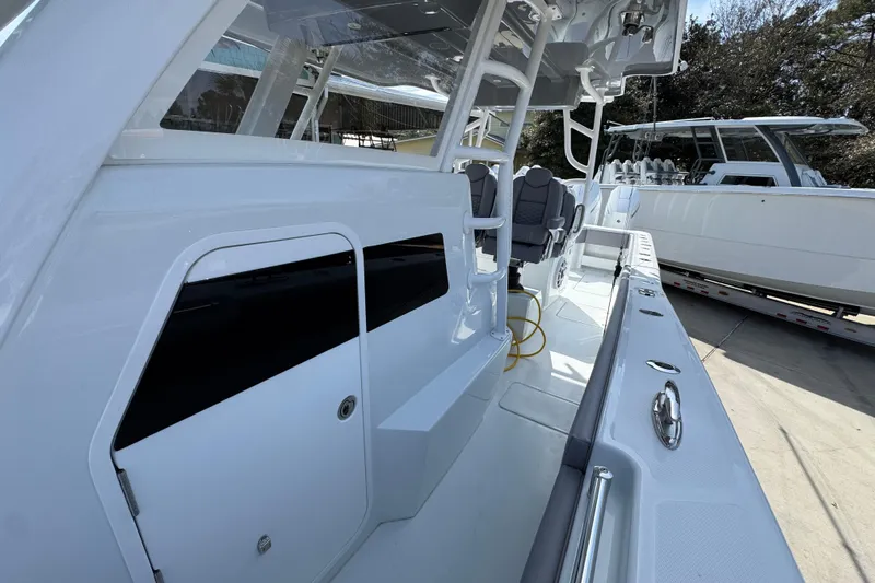  Yacht Photos Pics 2026 Invincible 43 Open Fisherman boat interior with seating and storage compartments.