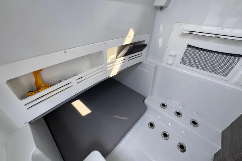  Yacht Photos Pics 2026 Invincible 43 Open Fisherman interior with storage compartments and seating area.