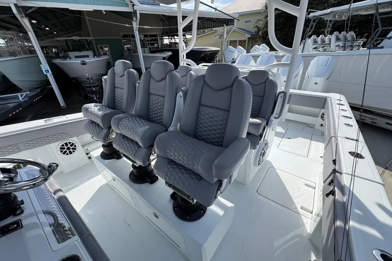  Yacht Photos Pics 2026 Invincible 43 Open Fisherman boat with luxurious seating and modern design.