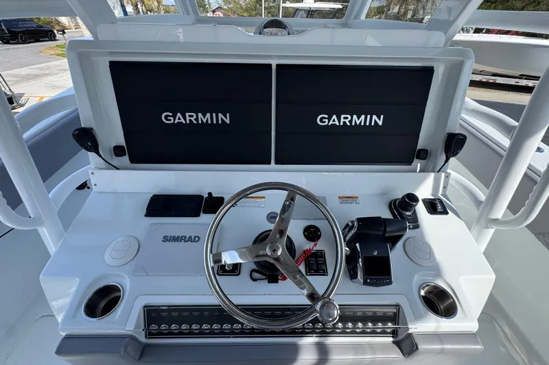  Yacht Photos Pics 2026 Invincible 43 Open Fisherman helm with dual Garmin displays and Simrad controls.