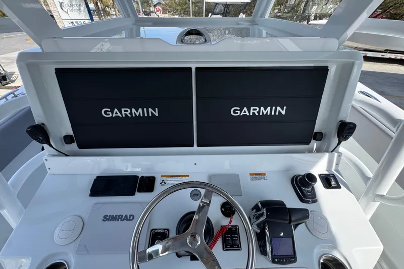  Yacht Photos Pics Helm of 2026 Invincible 43 Open Fisherman with Garmin displays and Simrad controls.