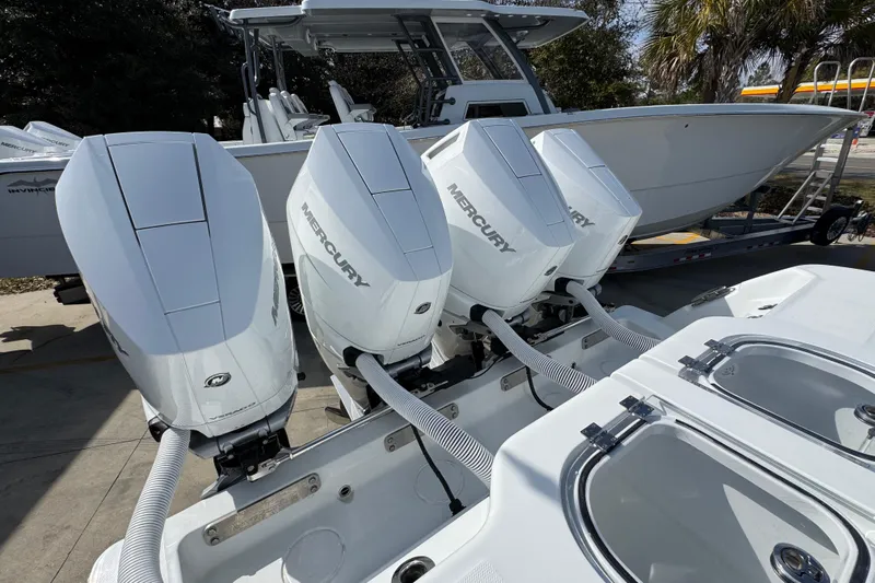  Yacht Photos Pics 2026 Invincible 43 Open Fisherman with four Mercury outboard engines, docked and ready.