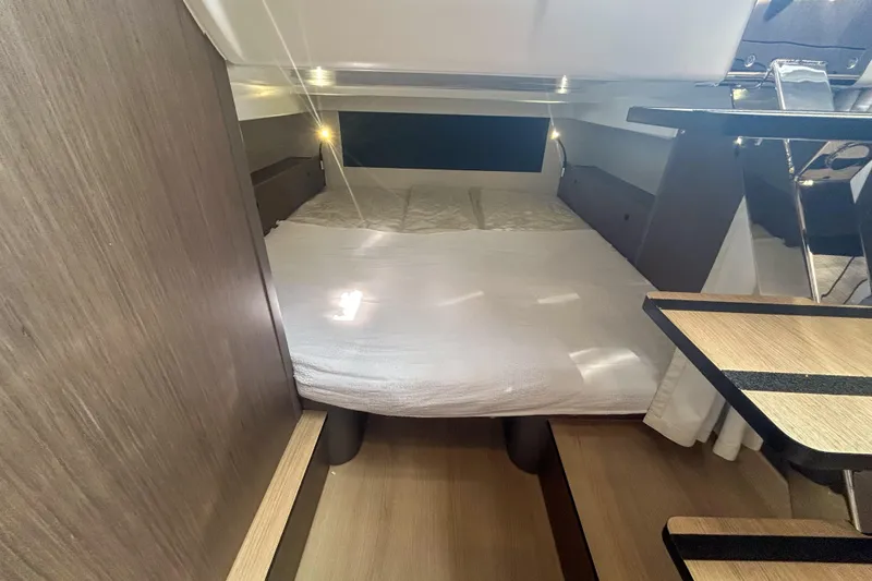  Yacht Photos Pics 2026 Beneteau Gran Turismo 35 cabin interior with cozy bed and modern design.