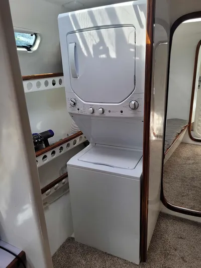 Stella Maris Yacht Photos Pics Stacked washer and dryer in a 2016 Custom 50 Len Jenkins boat interior.