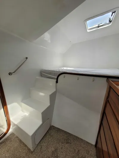 Stella Maris Yacht Photos Pics Interior of 2016 Custom 50 Len Jenkins boat with stairs and bed.