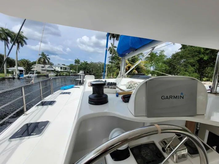 Stella Maris Yacht Photos Pics 2016 Custom 50 Len Jenkins yacht with Garmin navigation, docked by a scenic canal.