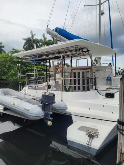 Stella Maris Yacht Photos Pics Custom 50 Len Jenkins 2016 catamaran docked with inflatable boat and lush greenery.