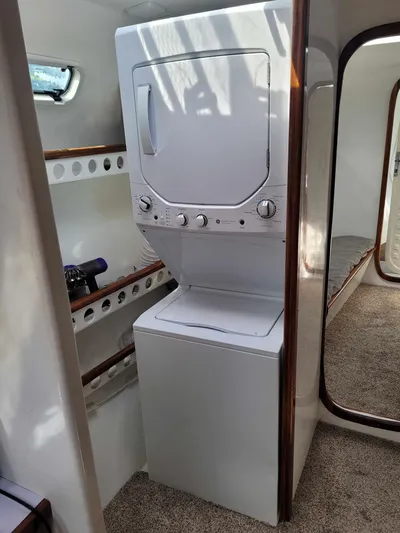 Stella Maris Yacht Photos Pics Stacked washer and dryer in a 2016 Custom 50 Len Jenkins boat interior.