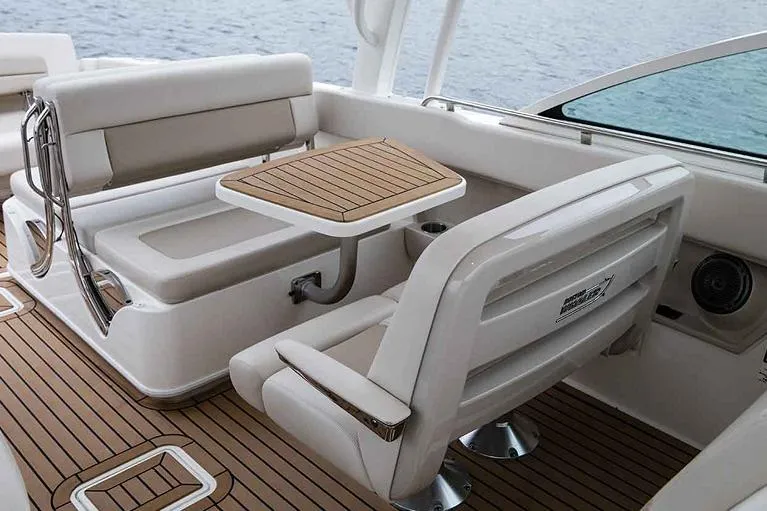  Yacht Photos Pics Manufacturer Provided Image: Boston Whaler 320 Vantage 2023 boat interior with seating and table.