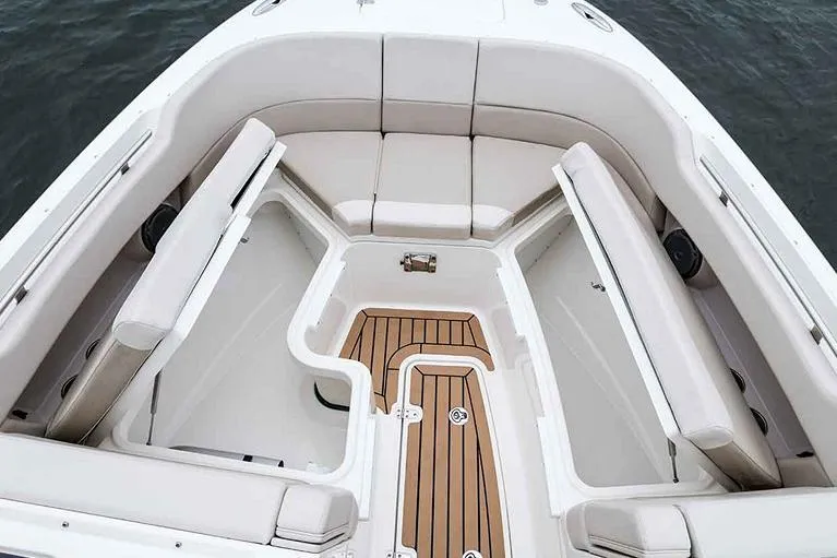  Yacht Photos Pics Manufacturer Provided Image: 2023 Boston Whaler 320 Vantage boat interior with cushioned seating and storage compartments.