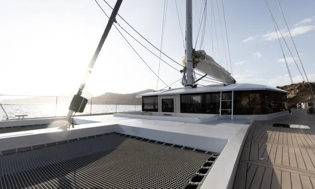  Yacht Photos Pics Modern Eyecat 55 Autumn catamaran sailing at sunset, 2024 model, with sleek design and spacious deck.