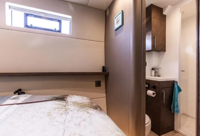 Yacht Photos Pics Compact yacht bedroom with ensuite bathroom, featuring modern design and natural light. Eyecat 55 Autumn 2024.