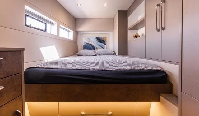  Yacht Photos Pics Modern bedroom interior in 2024 Eyecat 55 Autumn, featuring sleek design and ambient lighting.