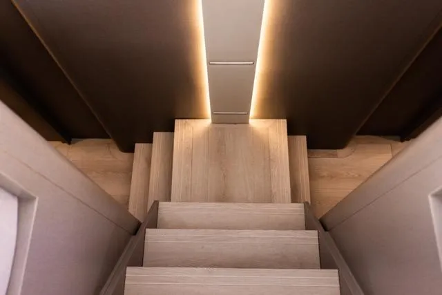  Yacht Photos Pics Modern wooden staircase with ambient lighting, Eyecat 55 Autumn 2024 model.