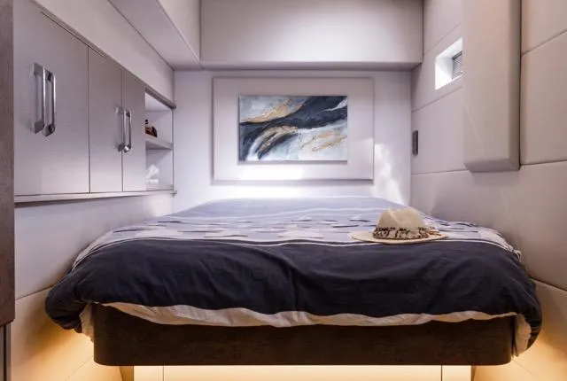  Yacht Photos Pics Luxurious bedroom in 2024 Eyecat 55 Autumn yacht with modern decor and artwork.