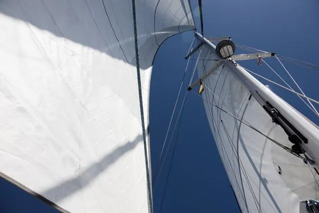  Yacht Photos Pics Sailboat mast and sails against clear blue sky, Eyecat 55 Autumn, 2024 model.
