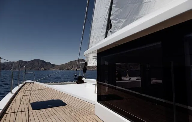  Yacht Photos Pics Sleek Eyecat 55 Autumn yacht sailing on a serene lake, 2024 model.