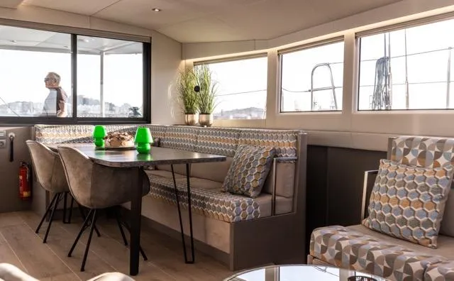  Yacht Photos Pics Luxurious interior of 2024 Eyecat 55 Autumn yacht with modern dining area and stylish decor.