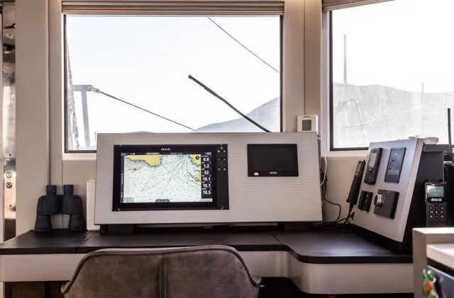  Yacht Photos Pics Modern navigation station inside 2024 Eyecat 55 Autumn yacht, featuring advanced control panels and equipment.