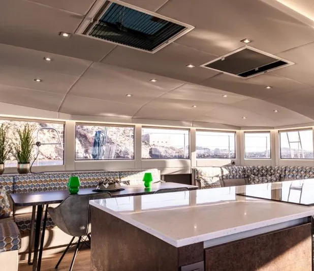  Yacht Photos Pics Luxurious interior of 2024 Eyecat 55 Autumn yacht with modern seating and panoramic windows.