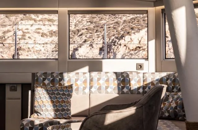  Yacht Photos Pics Luxurious interior of 2024 Eyecat 55 Autumn yacht with geometric-patterned seating.