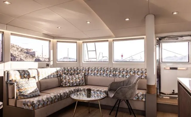  Yacht Photos Pics Luxurious Eyecat 55 Autumn 2024 yacht interior with modern seating and panoramic windows.