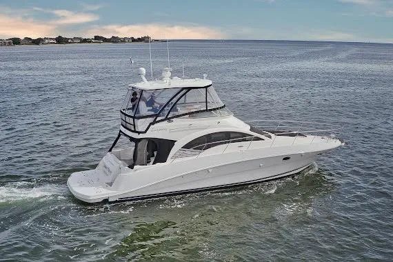  Yacht Photos Pics 2008 Sea Ray 47 Sedan Bridge yacht cruising on open water.