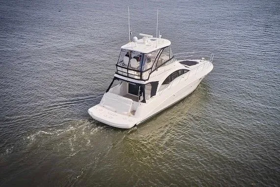  Yacht Photos Pics 2008 Sea Ray 47 Sedan Bridge yacht cruising on open water.