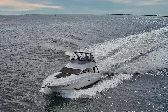  Yacht Photos Pics 2008 Sea Ray 47 Sedan Bridge yacht cruising on open water.