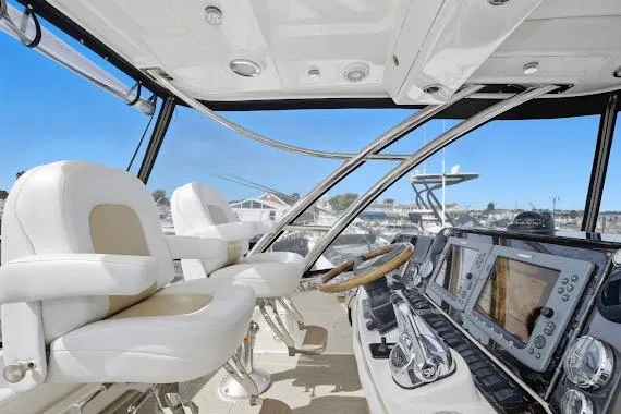  Yacht Photos Pics 2008 Sea Ray 47 Sedan Bridge helm with modern navigation equipment and luxurious seating.