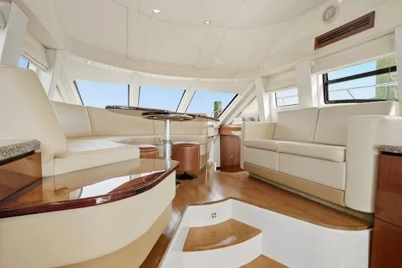  Yacht Photos Pics Luxurious interior of 2008 Sea Ray 47 Sedan Bridge yacht with elegant seating and panoramic windows.