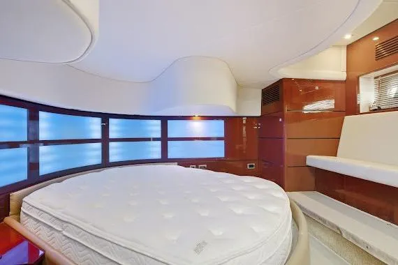 Yacht Photos Pics Luxurious interior of 2008 Sea Ray 47 Sedan Bridge yacht with round bed and modern design.