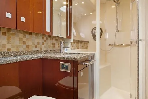  Yacht Photos Pics Luxurious bathroom in 2008 Sea Ray 47 Sedan Bridge yacht with modern fixtures.