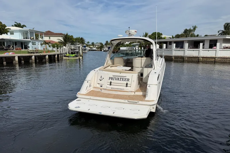  Yacht Photos Pics 2012 Sea Ray 370 Sundancer yacht cruising in a residential canal.