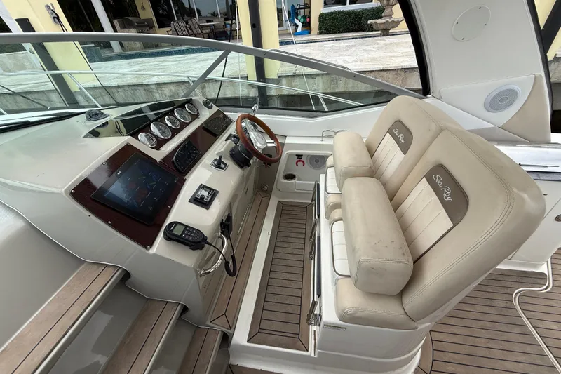  Yacht Photos Pics 2012 Sea Ray 370 Sundancer helm with dual seats and modern controls.
