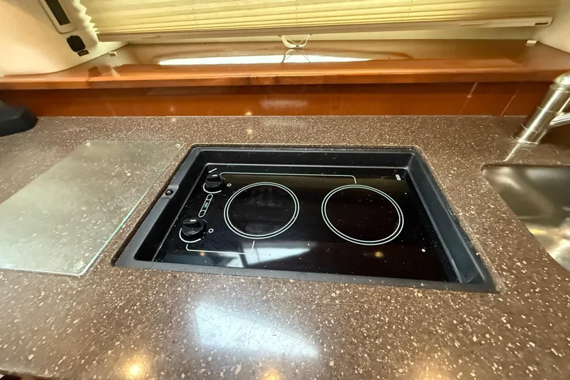  Yacht Photos Pics Modern kitchen area in 2012 Sea Ray 370 Sundancer yacht with electric cooktop.