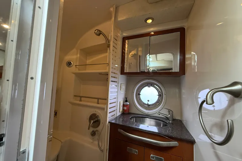  Yacht Photos Pics Luxurious bathroom interior of 2012 Sea Ray 370 Sundancer yacht with modern fixtures.