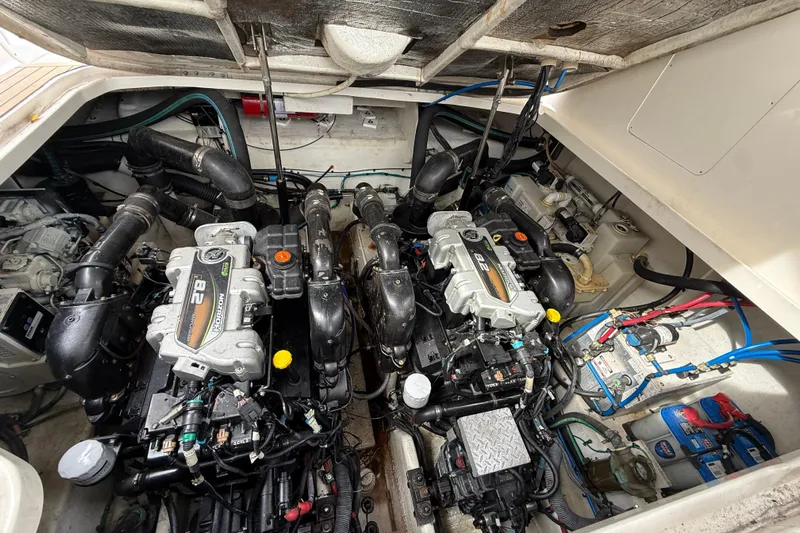  Yacht Photos Pics Engine room of a 2012 Sea Ray 370 Sundancer, showcasing dual engines and mechanical components.