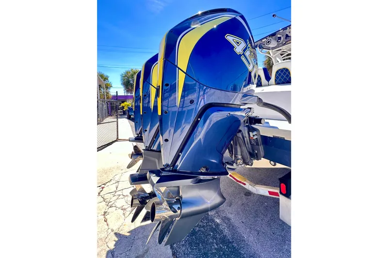  Yacht Photos Pics 2022 Midnight Express 37 Open boat with powerful outboard engines, parked outdoors.