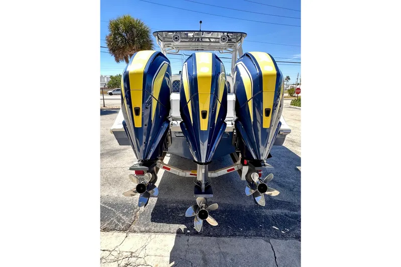  Yacht Photos Pics 2022 Midnight Express 37 Open boat with triple outboard engines, rear view.